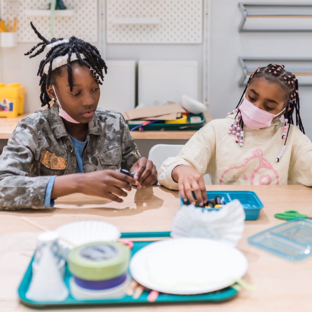 Kids participating in an activity in the Tinkerers Studio