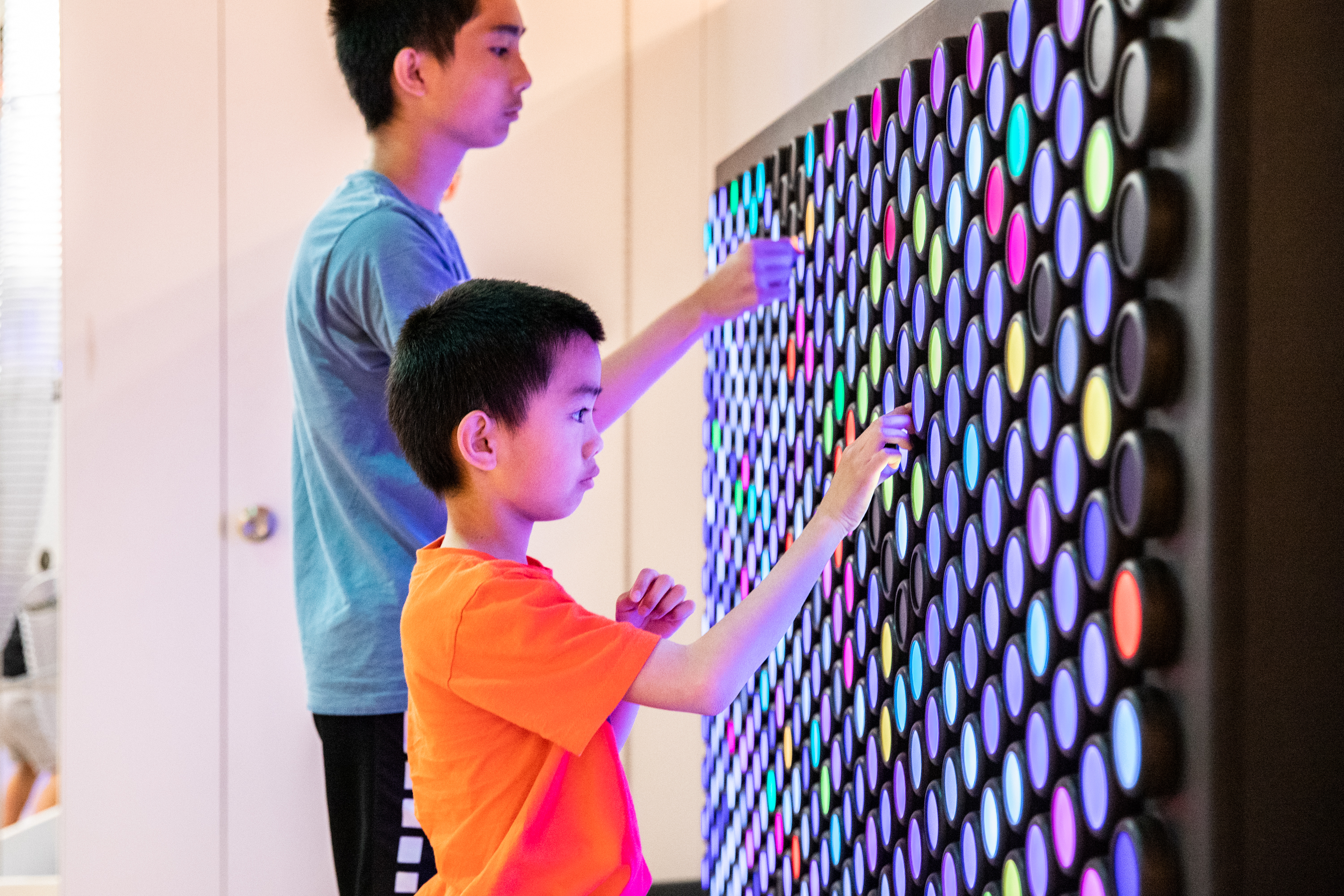 Two young boys at Everbrite in the Data Science Alley exhibit