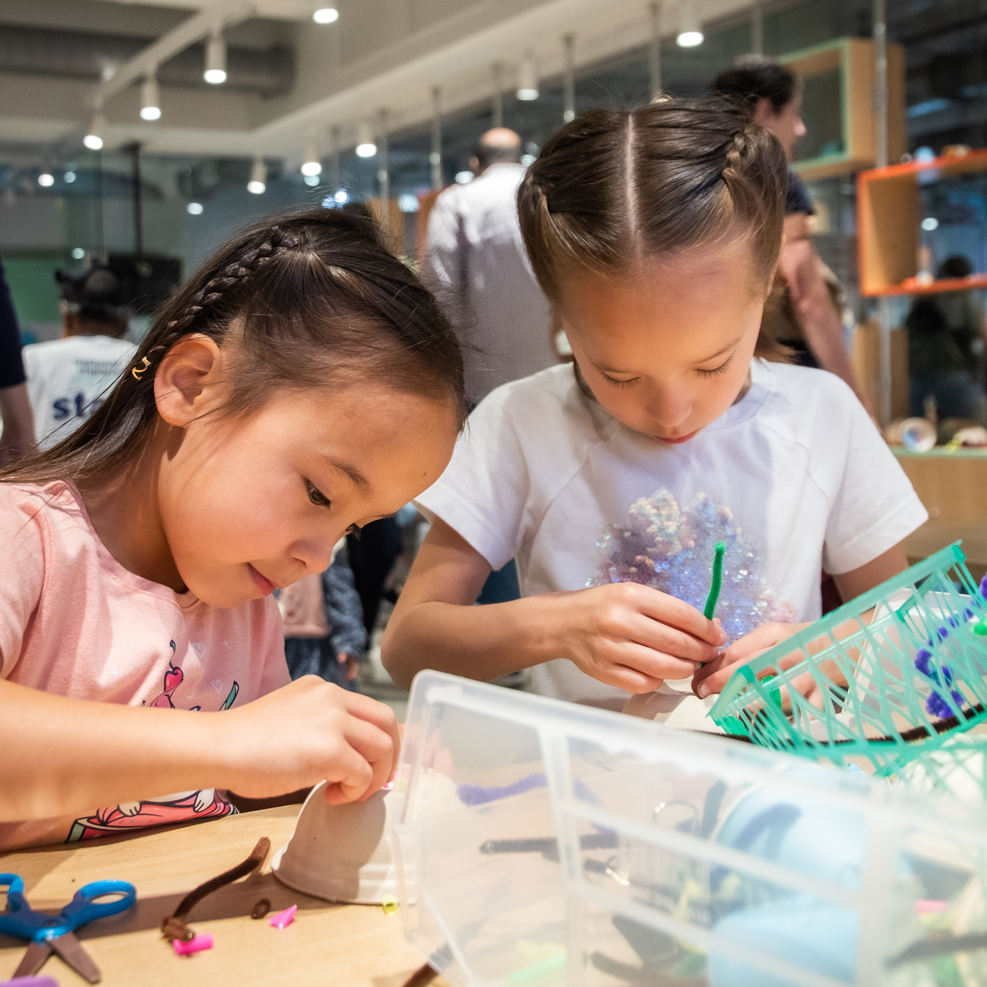 Two young girls building in the tinkerers studio.